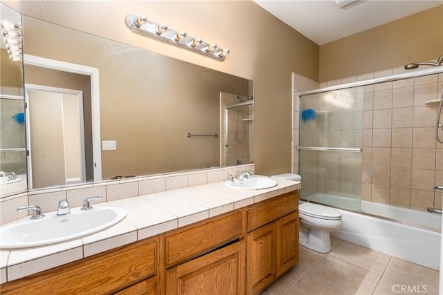 13212 Primavera Rd, Pinon Hills, CA 92372 - full bath featuring tile patterned floors, double vanity, and combined bath / shower with glass door