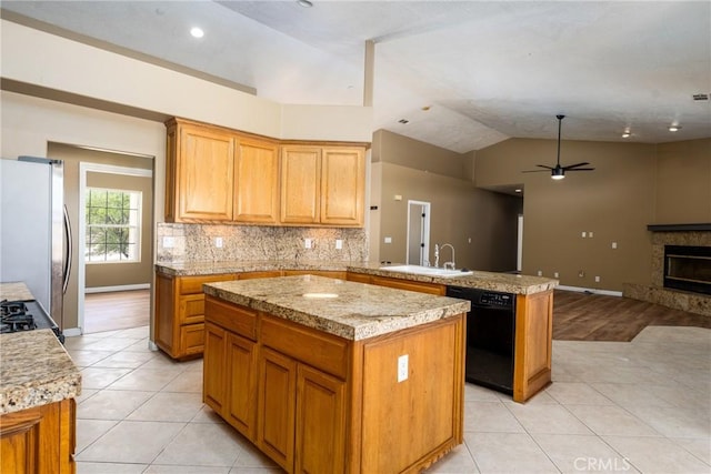 13212 Primavera Rd, Pinon Hills, CA 92372 - kitchen featuring dishwasher, freestanding refrigerator, light tile patterned floors, a peninsula, and vaulted ceiling