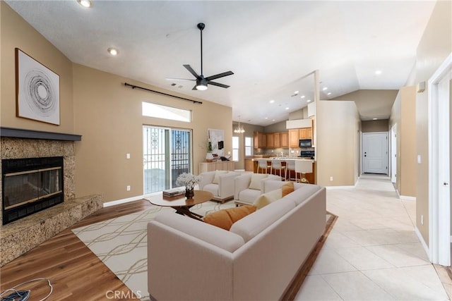 13212 Primavera Rd, Pinon Hills, CA 92372 - living area featuring a ceiling fan, lofted ceiling, a high end fireplace, recessed lighting, and light wood-type flooring