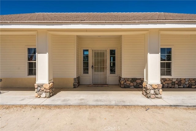 13212 Primavera Rd, Pinon Hills, CA 92372 - view of exterior entry featuring stone siding