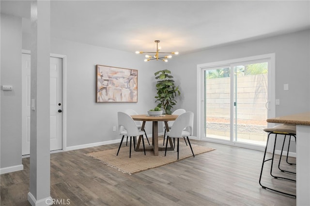 6831 Valinda Ave, Rancho Cucamonga, CA 91701 - dining space featuring wood finished floors and a chandelier
