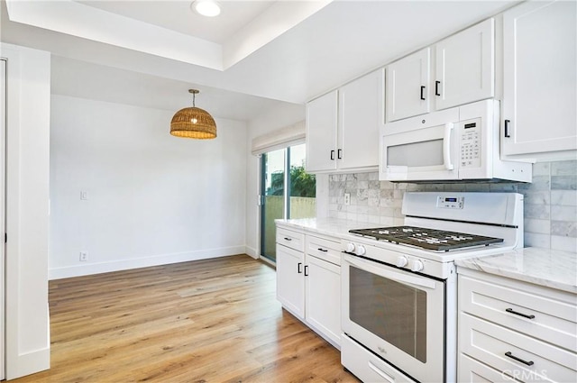33621 Blue Lantern St, Dana Point, CA 92629 - kitchen with white appliances, light stone counters, white cabinetry, backsplash, and recessed lighting