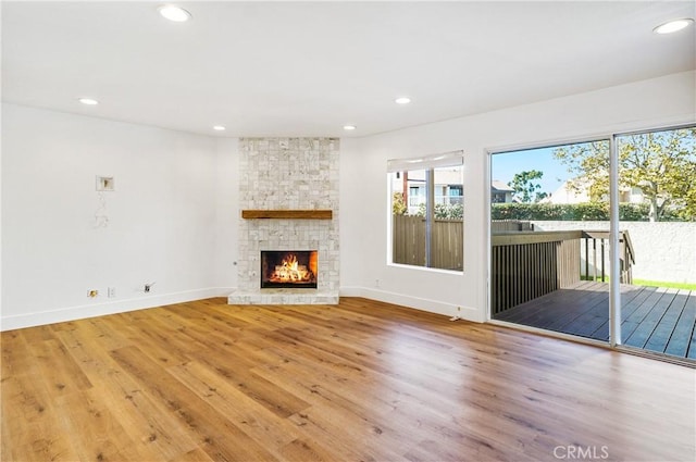33621 Blue Lantern St, Dana Point, CA 92629 - unfurnished living room featuring wood finished floors, recessed lighting, and a stone fireplace