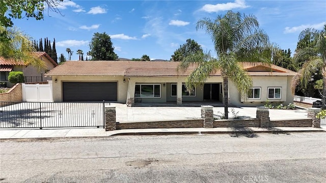 2521 Double Tree Ln, Rowland Heights, CA 91748 - view of front of home featuring an attached garage, stucco siding, driveway, and a tiled roof