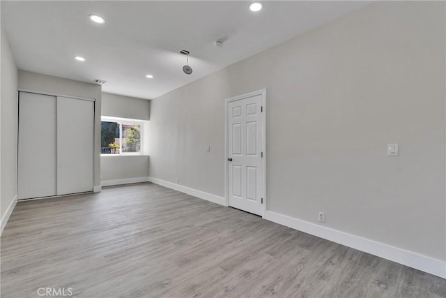 2521 Double Tree Ln, Rowland Heights, CA 91748 - unfurnished bedroom featuring recessed lighting, wood finished floors, and a closet