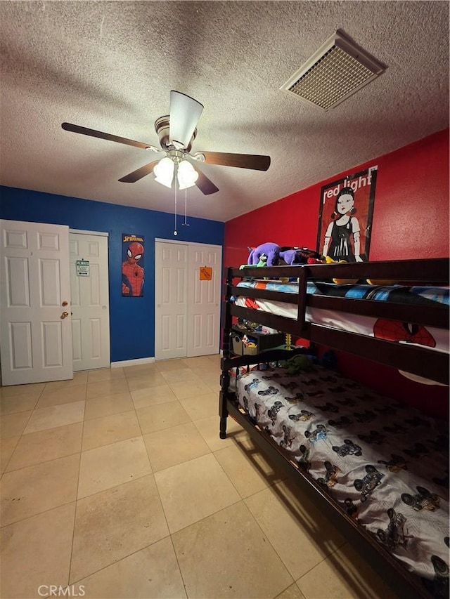 11815 Arliss Way, Grand Terrace, CA 92313 - bedroom featuring a textured ceiling, tile patterned floors, and ceiling fan