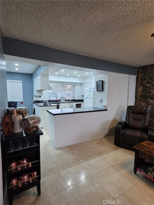 11815 Arliss Way, Grand Terrace, CA 92313 - living area featuring light tile patterned floors and a textured ceiling