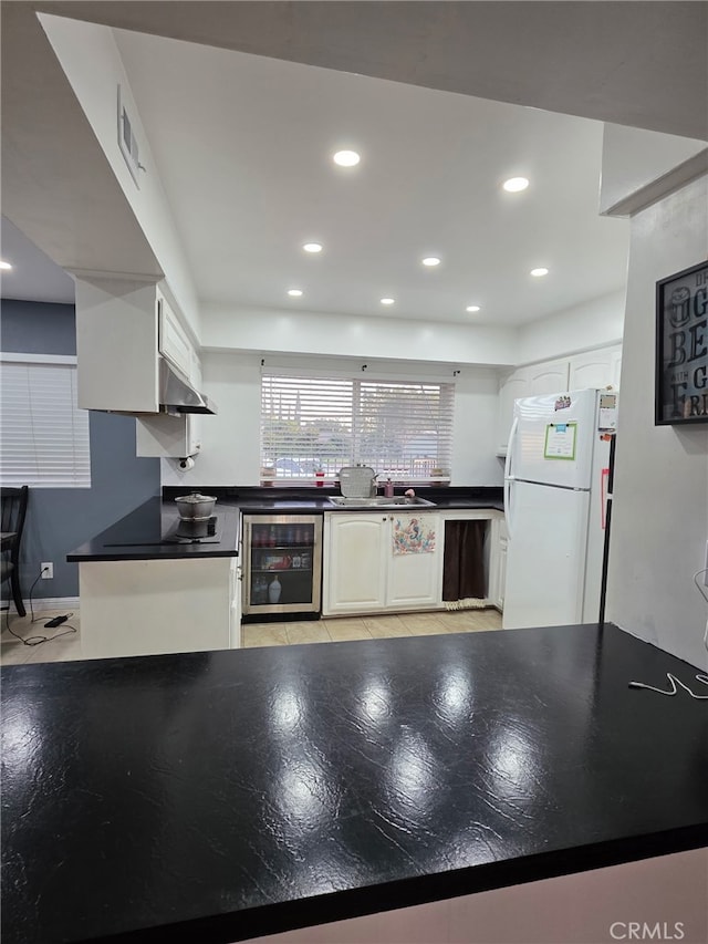 11815 Arliss Way, Grand Terrace, CA 92313 - kitchen with wine cooler, freestanding refrigerator, dark countertops, recessed lighting, and light tile patterned floors