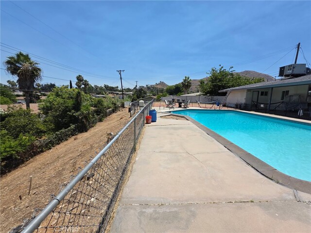 11815 Arliss Way, Grand Terrace, CA 92313 - view of swimming pool with a patio