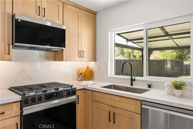26871 Via Santa Lucia, Mission Viejo, CA 92691 - kitchen featuring appliances with stainless steel finishes, plenty of natural light, light brown cabinetry, and tasteful backsplash