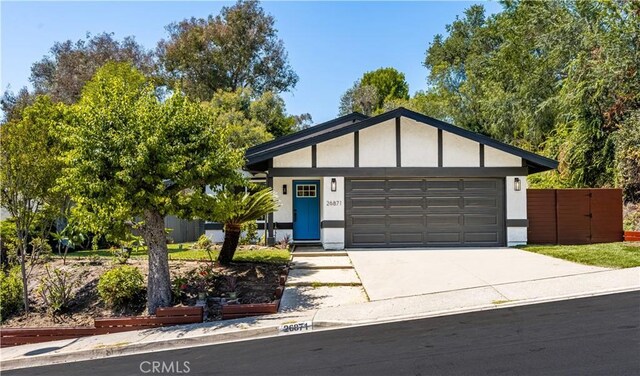 26871 Via Santa Lucia, Mission Viejo, CA 92691 - view of front of house with concrete driveway, an attached garage, and stucco siding