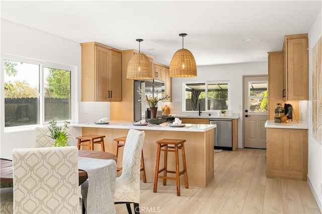 26871 Via Santa Lucia, Mission Viejo, CA 92691 - kitchen with stainless steel appliances, a peninsula, plenty of natural light, light countertops, and recessed lighting