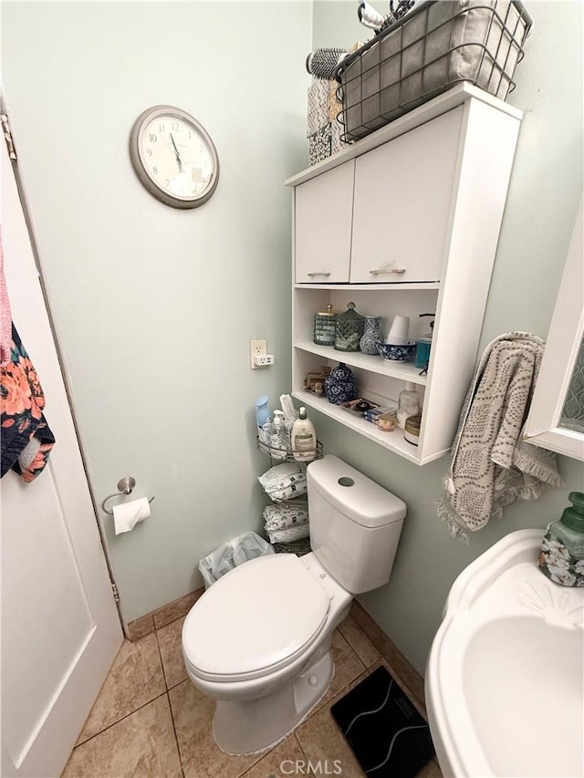 516 N Brand Blvd, San Fernando, CA 91340 - half bathroom featuring toilet and tile patterned flooring