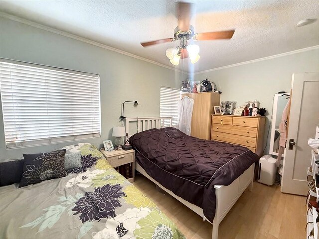 516 N Brand Blvd, San Fernando, CA 91340 - bedroom with light wood finished floors, ornamental molding, a textured ceiling, and ceiling fan