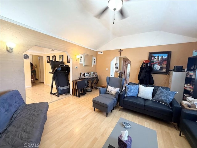 516 N Brand Blvd, San Fernando, CA 91340 - living area with arched walkways, a ceiling fan, vaulted ceiling, and light wood-style flooring