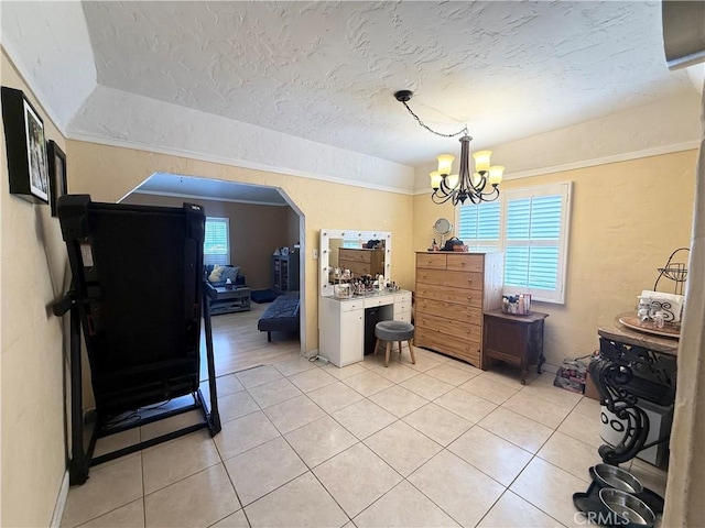 516 N Brand Blvd, San Fernando, CA 91340 - dining space with healthy amount of natural light, light tile patterned floors, a chandelier, and a textured ceiling