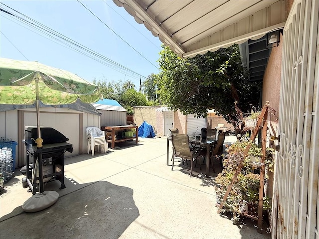 516 N Brand Blvd, San Fernando, CA 91340 - view of patio featuring a shed and outdoor dining area