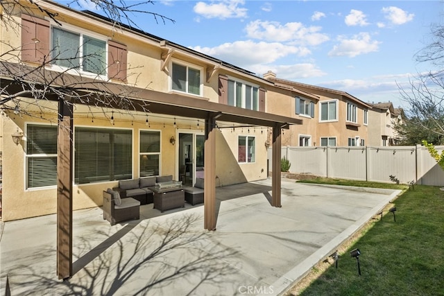 17656 Gladesworth Ln, Canyon Country, CA 91387 - rear view of property featuring stucco siding, a patio, outdoor lounge area, and a residential view