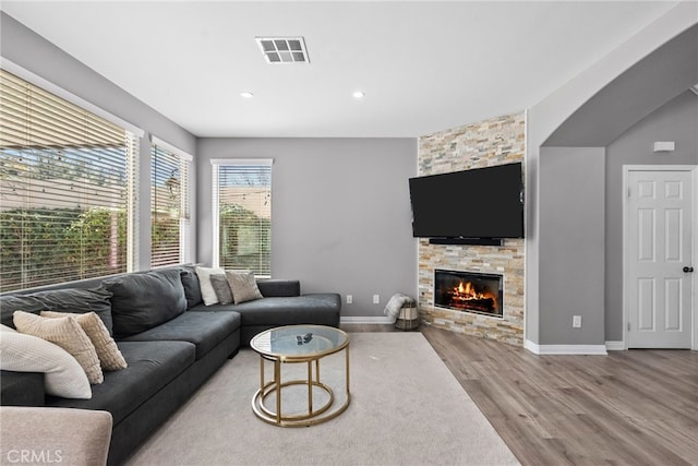 17656 Gladesworth Ln, Canyon Country, CA 91387 - living area with wood finished floors, recessed lighting, and a fireplace