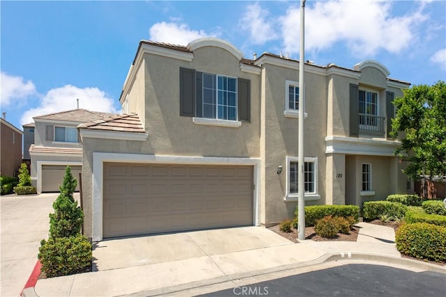 120 Rue Monet, Lake Forest, CA 92610 - view of front of home with stucco siding, a tiled roof, driveway, and a garage