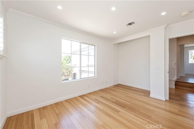 120 Rue Monet, Lake Forest, CA 92610 - spare room featuring plenty of natural light, crown molding, light wood-style flooring, recessed lighting, and a smoke detector