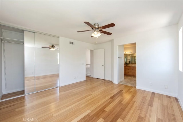 120 Rue Monet, Lake Forest, CA 92610 - unfurnished bedroom featuring light wood-style floors, ceiling fan, connected bathroom, and a closet