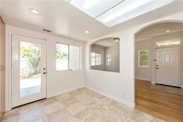 120 Rue Monet, Lake Forest, CA 92610 - entryway with healthy amount of natural light, arched walkways, and recessed lighting