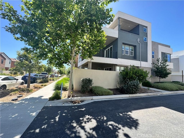 325 Sawbuck, Irvine, CA 92618 - view of home's exterior featuring stucco siding