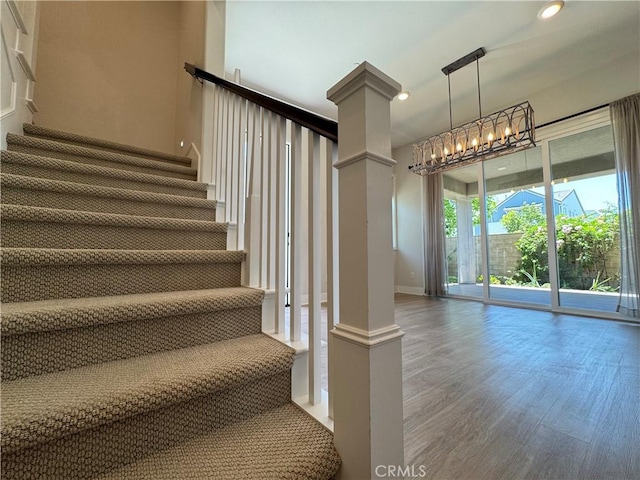 325 Sawbuck, Irvine, CA 92618 - stairs featuring wood finished floors, recessed lighting, and a chandelier