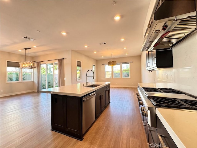 325 Sawbuck, Irvine, CA 92618 - kitchen featuring stainless steel dishwasher, ventilation hood, a chandelier, open floor plan, and recessed lighting