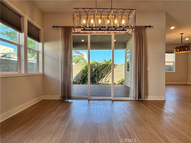 325 Sawbuck, Irvine, CA 92618 - unfurnished dining area with a chandelier, wood finished floors, and recessed lighting