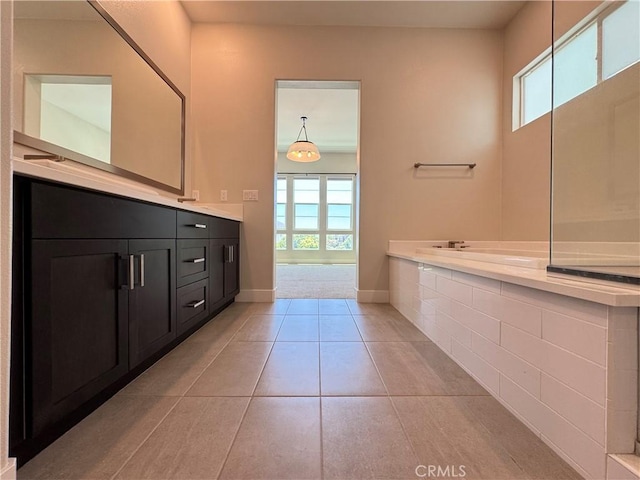 325 Sawbuck, Irvine, CA 92618 - bathroom featuring plenty of natural light, vanity, tile patterned floors, and tiled tub