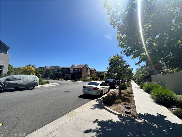 325 Sawbuck, Irvine, CA 92618 - view of asphalt street featuring sidewalks, curbs, and a residential view