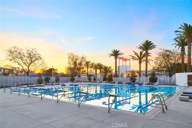 325 Sawbuck, Irvine, CA 92618 - pool at dusk with a community pool and a patio area