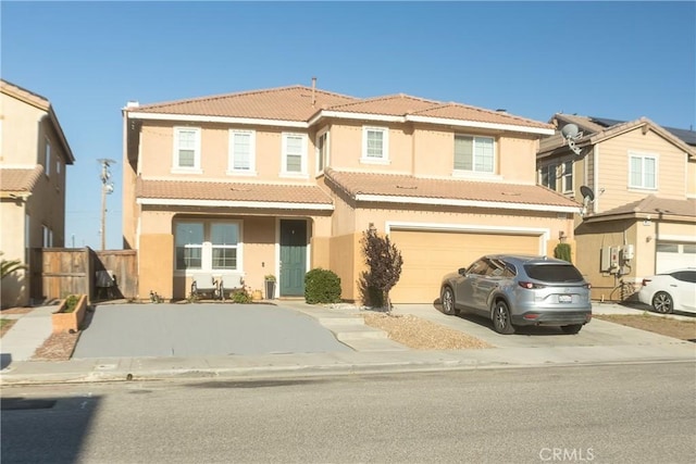 8851 Montclair Ave, Hesperia, CA 92344 - view of front facade with driveway, a tile roof, stucco siding, and a garage