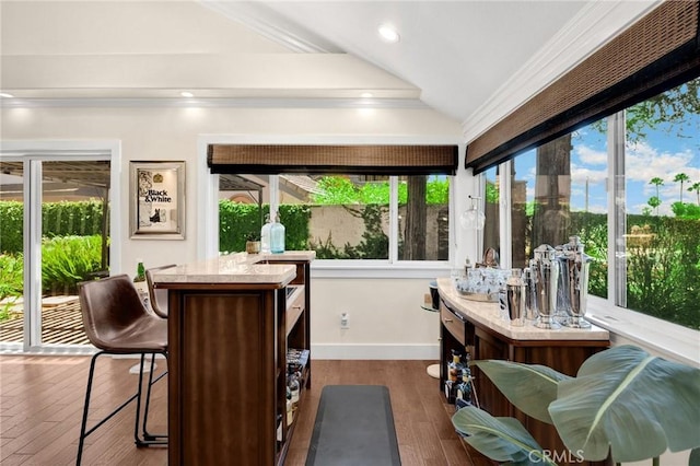 772 N Malden Ave, Fullerton, CA 92832 - sunroom with ornamental molding, vaulted ceiling, bar area, and wood finished floors