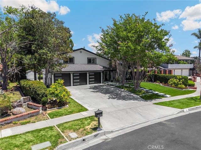 772 N Malden Ave, Fullerton, CA 92832 - view of front of home with an attached garage, concrete driveway, a front yard, and a shingled roof