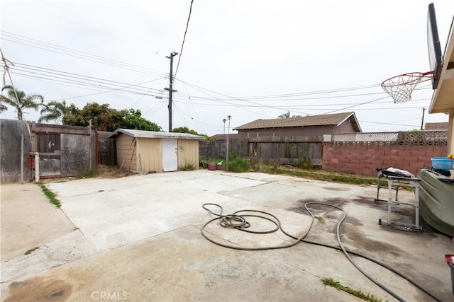 2820 S M St, Oxnard, CA 93033 - fenced backyard featuring a storage unit, a patio area, and a gate