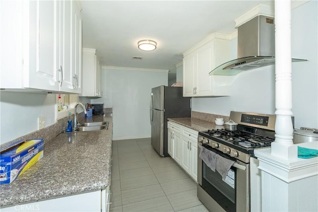 2820 S M St, Oxnard, CA 93033 - kitchen featuring stainless steel appliances, wall chimney range hood, white cabinets, crown molding, and light tile patterned floors
