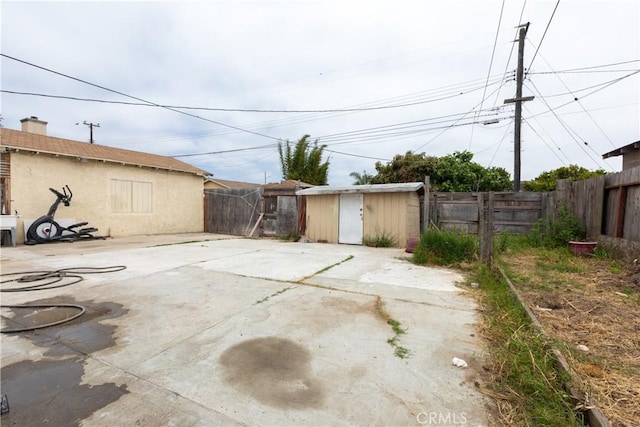 2820 S M St, Oxnard, CA 93033 - fenced backyard featuring a storage unit and a patio