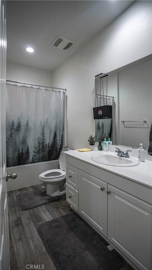 7600 Channel View St, Chino, CA 91708 - bathroom featuring vanity, shower / tub combo with curtain, wood finished floors, and recessed lighting
