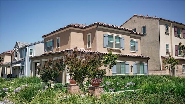 7600 Channel View St, Chino, CA 91708 - rear view of property with stucco siding and a tiled roof