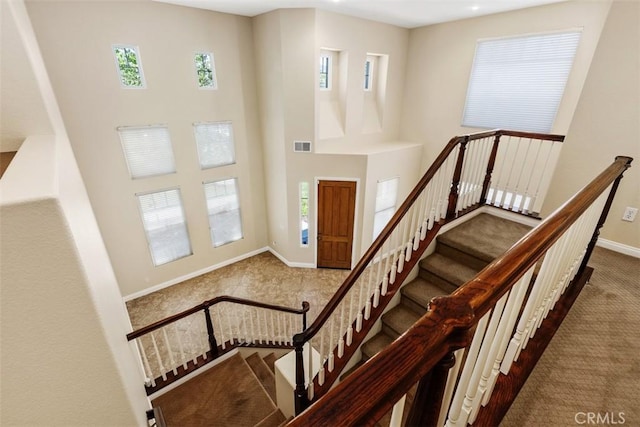 32974 Anasazi Dr, Temecula, CA 92592 - carpeted foyer entrance with baseboards and a towering ceiling