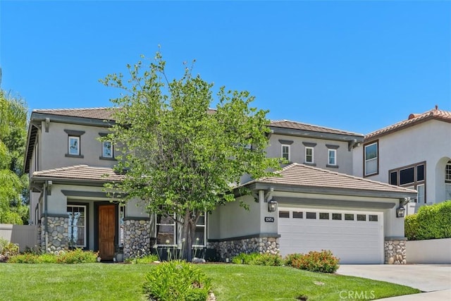 32974 Anasazi Dr, Temecula, CA 92592 - view of front facade featuring stone siding, a garage, a front yard, concrete driveway, and a tile roof