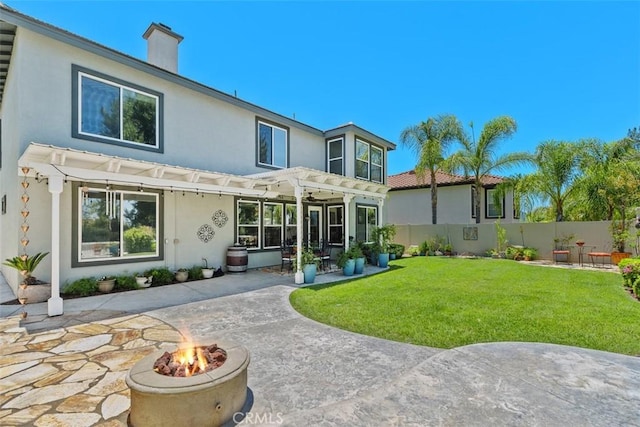 32974 Anasazi Dr, Temecula, CA 92592 - back of house with stucco siding, a pergola, a fire pit, and a patio