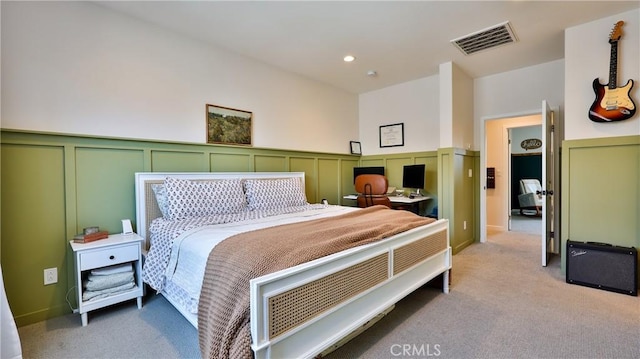 4173 Horvath St Unit 105, Corona, CA 92883 - bedroom with light colored carpet, a decorative wall, a wainscoted wall, and recessed lighting
