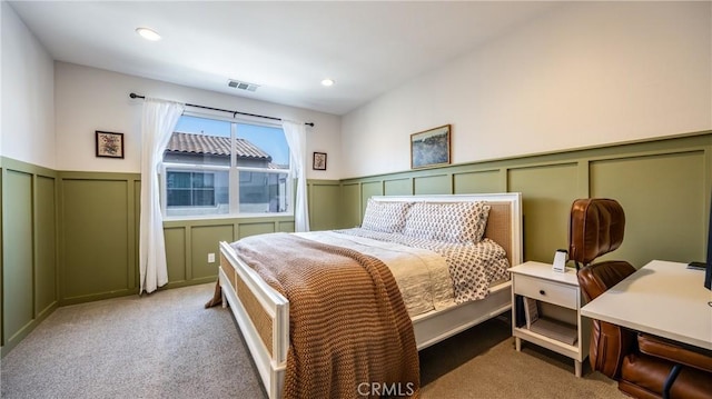 4173 Horvath St Unit 105, Corona, CA 92883 - carpeted bedroom with a decorative wall, wainscoting, and recessed lighting