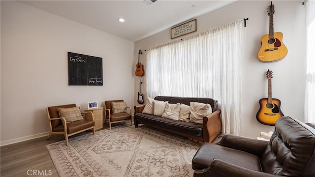 4173 Horvath St Unit 105, Corona, CA 92883 - living area with wood finished floors and recessed lighting