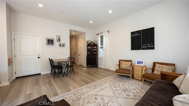 4173 Horvath St Unit 105, Corona, CA 92883 - living room with light wood-style floors and recessed lighting