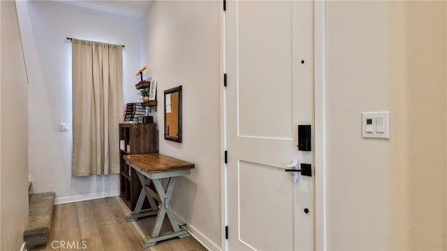 4173 Horvath St Unit 105, Corona, CA 92883 - hallway featuring light wood-style floors and baseboards